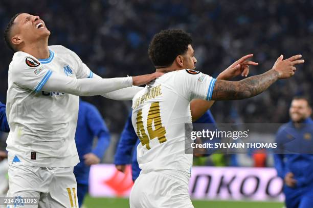 Marseille's Brazilian forward Luis Henrique celebrates scoring the winning penalty shoot out with Marseille's Moroccan French midfielder Amine Harit...