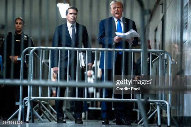 Republican presidential candidate, former President Donald Trump speaks to reporters with attorney Todd Blanche at the end of the day as jury...