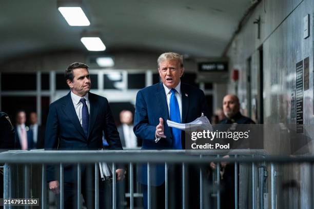 Republican presidential candidate, former President Donald Trump speaks to reporters with attorney Todd Blanche at the end of the day as jury...