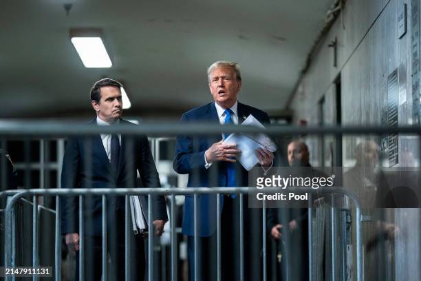 Republican presidential candidate, former President Donald Trump speaks to reporters with attorney Todd Blanche at the end of the day as jury...