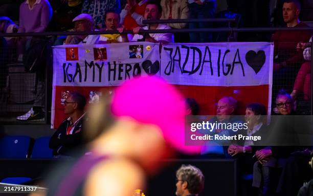 Fans cheer on Iga Swiatek of Poland on Day Four of the Porsche Tennis Grand Prix Stuttgart 2024 at Porsche Arena on April 18, 2024 in Stuttgart,...