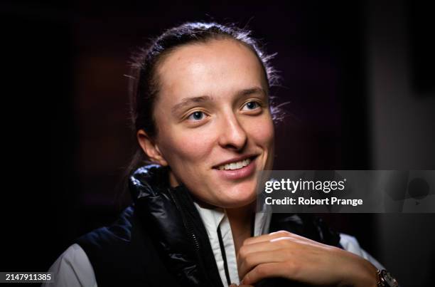 Iga Swiatek of Poland talks to the media after defeating Elise Mertens of Belgium in the second round on Day Four of the Porsche Tennis Grand Prix...