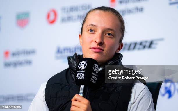 Iga Swiatek of Poland talks to the media after defeating Elise Mertens of Belgium in the second round on Day Four of the Porsche Tennis Grand Prix...