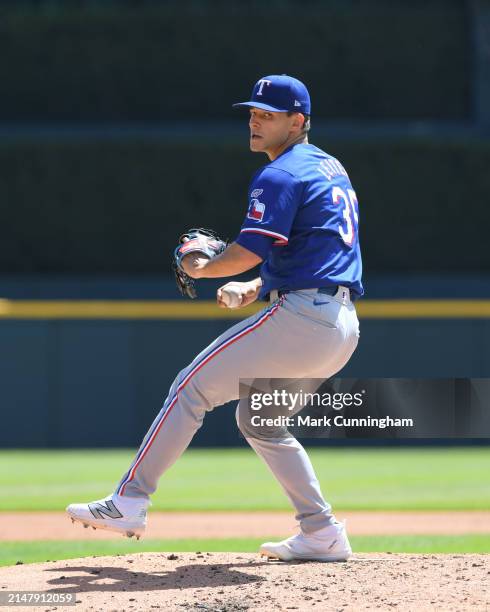 Jack Leiter of the Texas Rangers throws a warm-up pitch in his MLB debut game against the Detroit Tigers at Comerica Park on April 18, 2024 in...