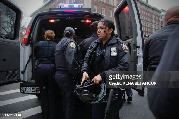 Officers arrive to a pro-Palestinian demonstration outside of Columbia University in New York City on April 18, 2024. Officers cleared out a...
