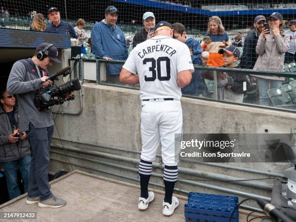 Detroit Tigers outfielder Kerry Carpenter signs autographs for fans before a regular season Major League Baseball game between the Texas Rangers and...