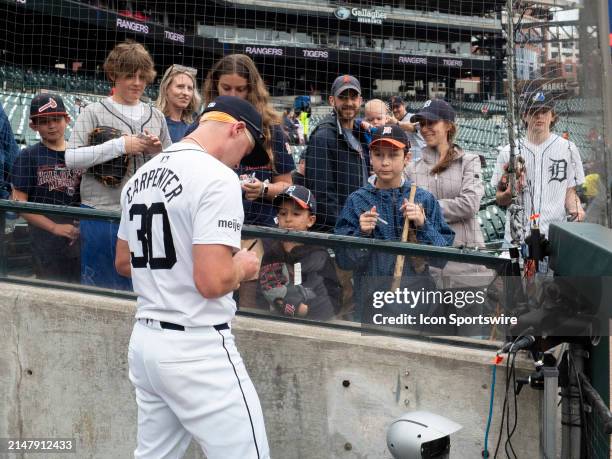 Detroit Tigers outfielder Kerry Carpenter signs autographs for fans before a regular season Major League Baseball game between the Texas Rangers and...