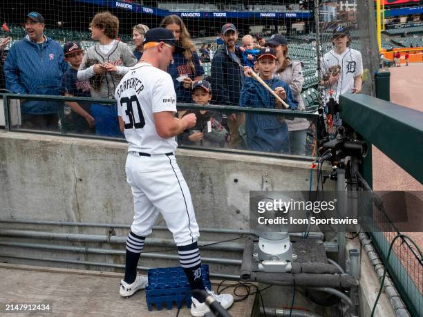 Detroit Tigers outfielder Kerry Carpenter signs autographs for fans before a regular season Major League Baseball game between the Texas Rangers and...