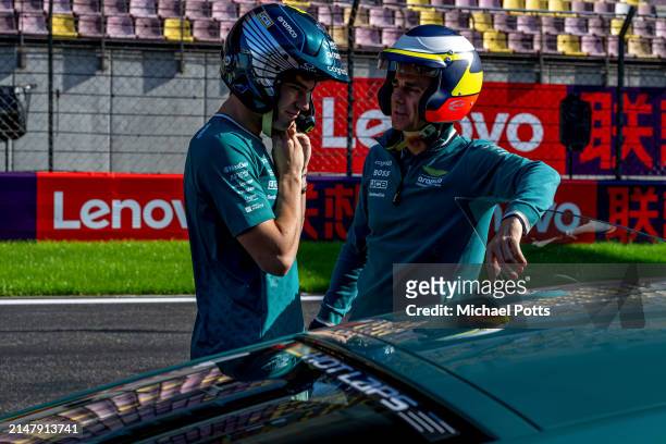 Aston Martin Pirelli Hot Laps activity. Lance Stroll, Aston Martin F1 Team, talks to Pedro de la Rosa, Team Ambassador, Aston Martin F1 Team during...