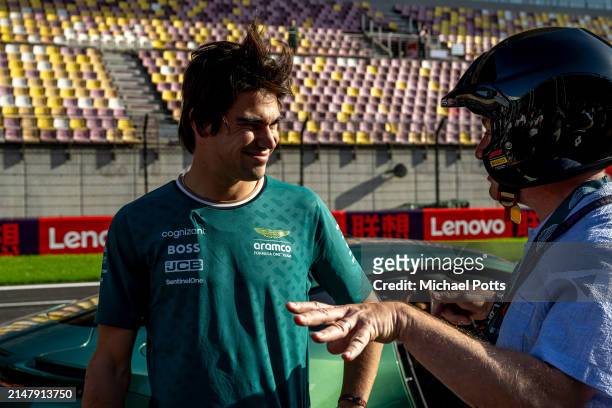 Aston Martin Pirelli Hot Laps activity. Lance Stroll, Aston Martin F1 Team, gives Craig Slater from Sky a ride during previews ahead of the F1 Grand...