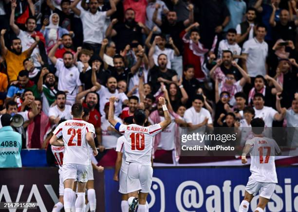 Aref Haitham of Jordan is celebrating after scoring a goal in the AFC U23 Asian Cup Qatar 2024 Group A match between Qatar and Jordan at Jassim Bin...