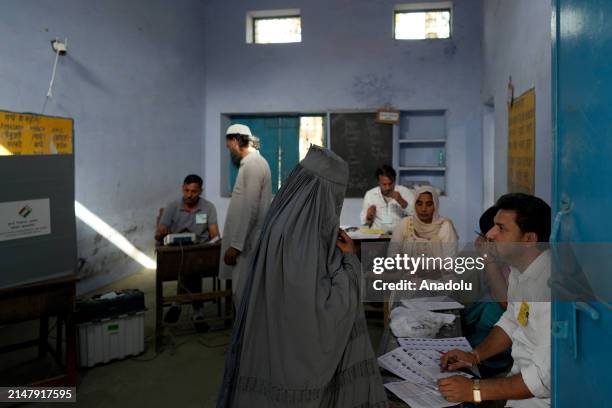 Muslim woman arrives a polling station to cast her vote during the first phase of the India's general elections in Kairana, Shamli district of the...