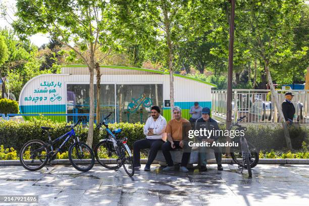 People walk on the streets and spend time in the city as they continue their daily lives after the news of the attacks in Isfahan, Iran on April 19,...