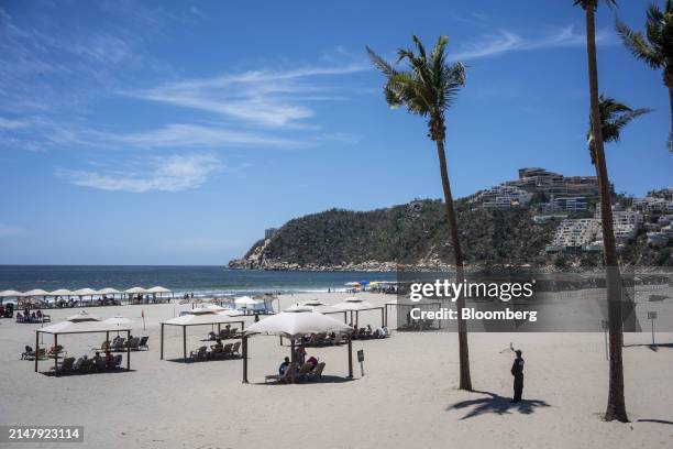 Cabanas on the beach for guests at the Pierre Mundo Imperial hotel in Acapulco, Guerrero state, Mexico, on Monday, March 25, 2024. It's a grim scene...