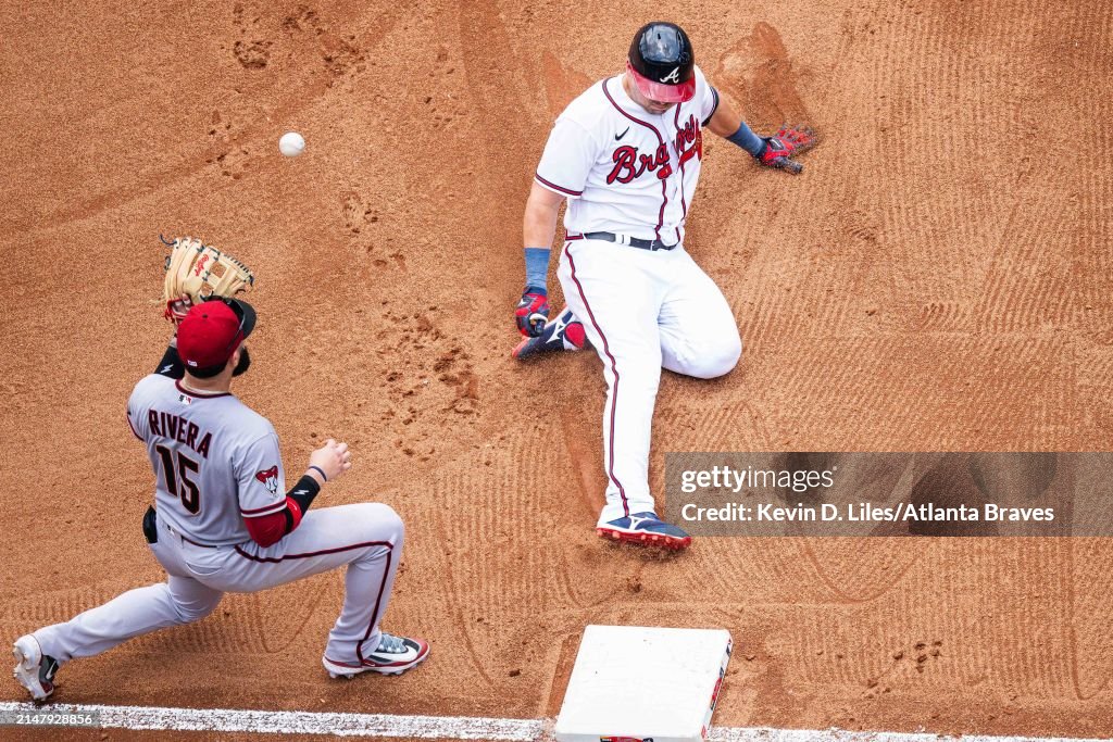 Roger Riley Arizona Diamondbacks Austin Riley of the Atlanta Braves slides into third during the game ...