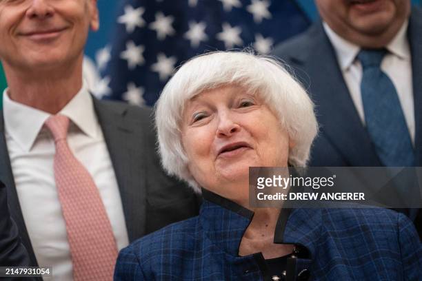 Treasury Secretary Janet Yellen stands for a group photo with the World Bank Group and Heads of Shareholder Delegations during the IMF-World Bank...