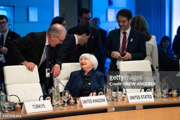 Swiss Federal Councillor Guy Parmelin speaks with US Treasury Secretary Janet Yellen during a meeting of the World Bank Development Committee during...