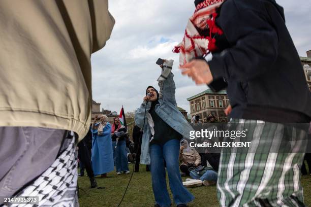 Pro-Palestinian students and activists chant as they protest on the campus of Columbia University in New York City on April 19, 2024. Police arrested...