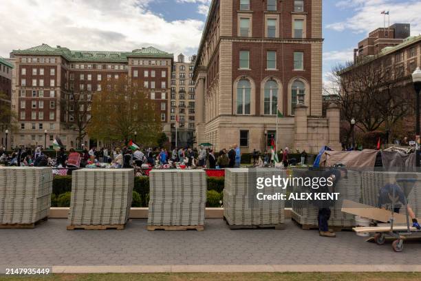 Pro-Palestinian students and activists camp out on the campus of Columbia University as workers make preparations ahead of graduation ceremonies in...