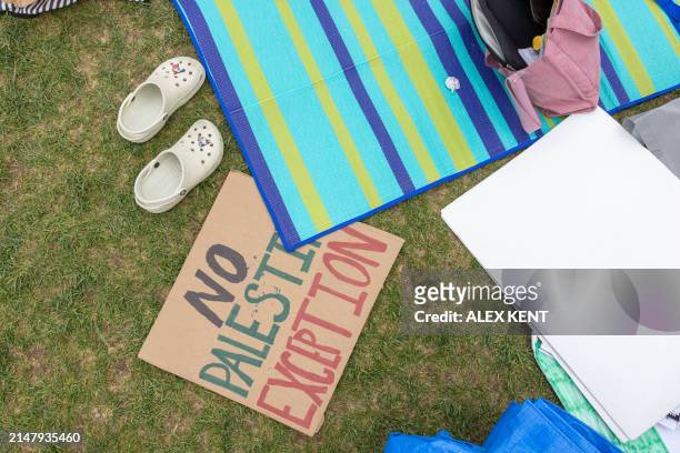 Sign is seen on the grass as pro-Palestinian students and activists camp out on the campus of Columbia University in New York City on April 19, 2024....