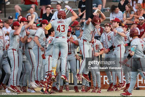 The Florida State Seminoles celebrate after scoring a home run in the first inning against the Wake Forest Demon Deacons at David F. Couch Ballpark...