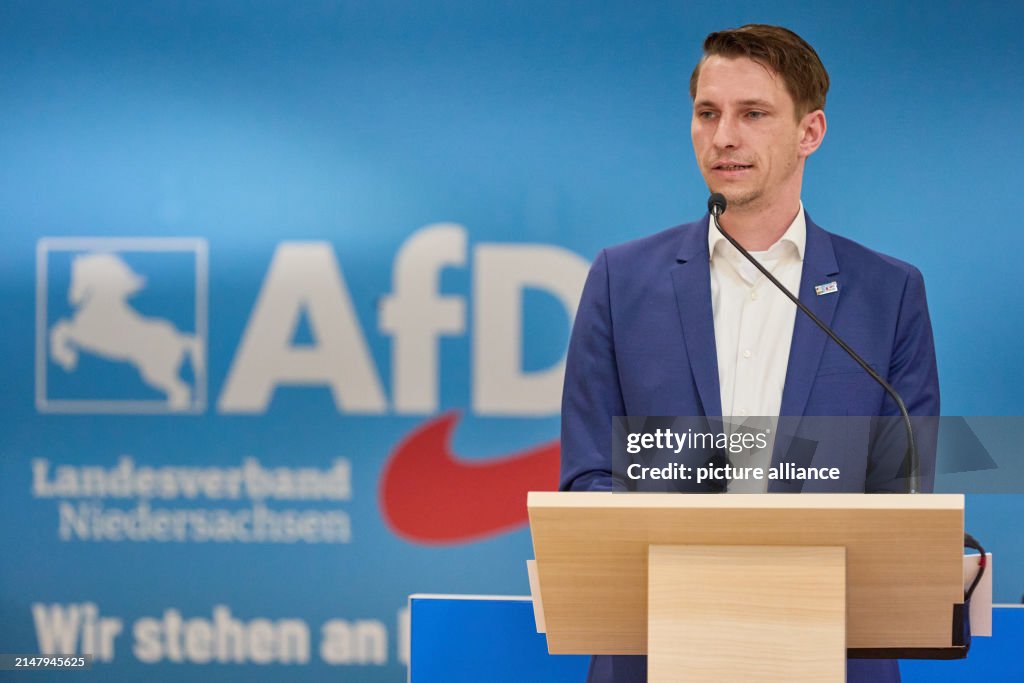 Frank Rinck Frank Rinck, , state chairman, stands on stage at the state party ...