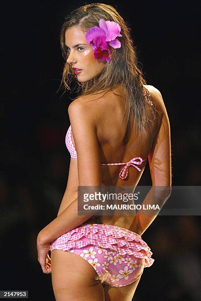 Model presents an outfit by Agua Doce during the Sao Paulo Fashion Week, 2004 spring-summer collection in Sao Paulo, Brazil, on 04 July 2003. AFP...