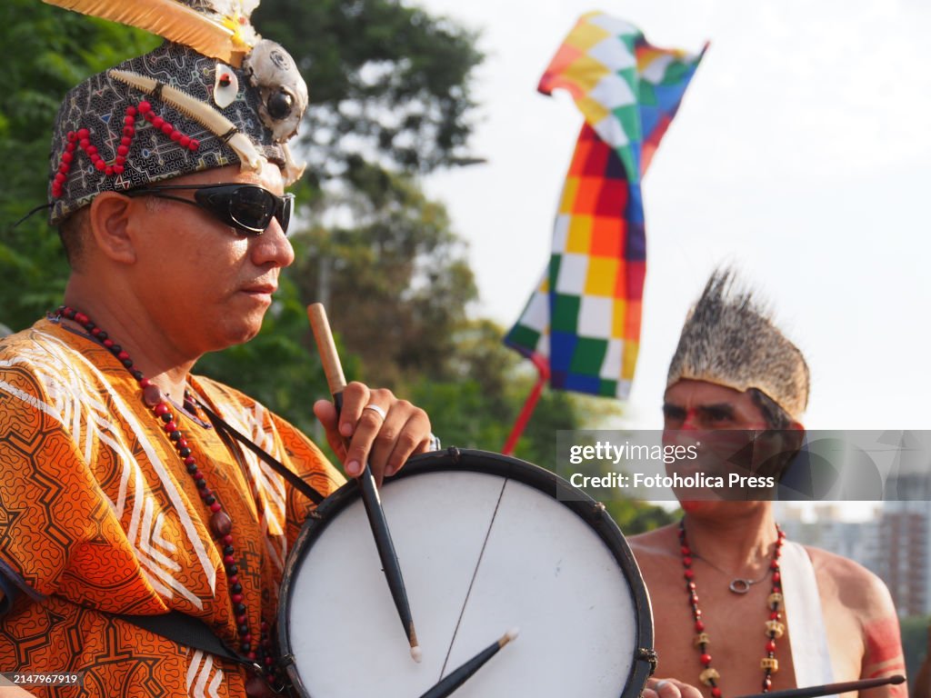 Indigenous Amazonian Instruments Amazonian indigenous people playing drums as dozens of demonstrators ...