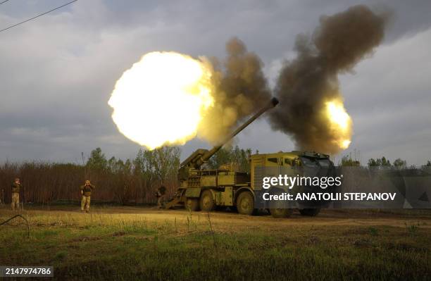 Gunners from 43rd Separate Mechanized Brigade of the Armed Forces of Ukraine fire at Russian position with a 155 mm self-propelled howitzer 2C22...