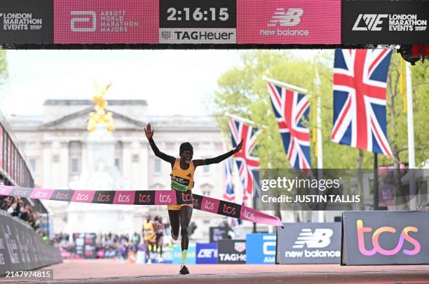 Kenya's Peres Jepchirchir crosses the line to win the women's race in a world record time for a women's only race at the 2024 London Marathon in...
