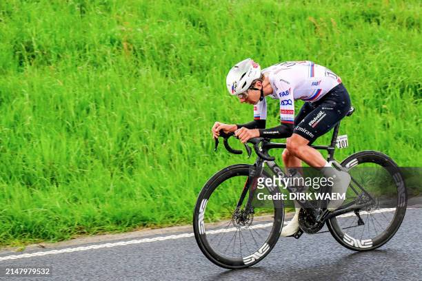 Team Emirates' Slovenian cyclist Tadej Pogacar rides as he leads the race during Liege-Bastogne-Liege one day cycling race 5 km round-trip from Liege...