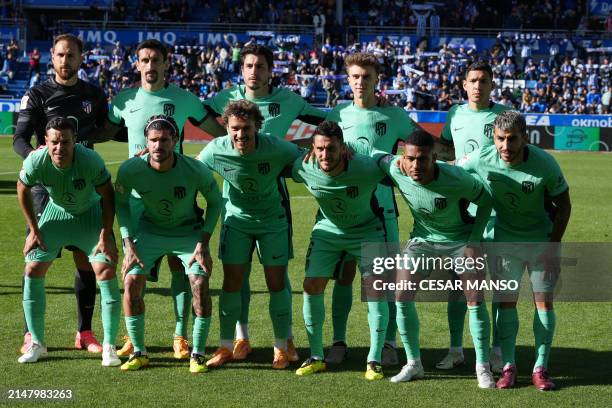 Atletico Madrid players pose for a team photo prior to the Spanish league football match between Deportivo Alaves and Club Atletico de Madrid at the...
