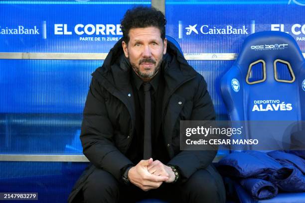 Atletico Madrid's Argentinian coach Diego Simeone is pictures sitting on the bench prior to the Spanish league football match between Deportivo...