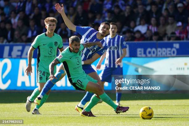 Atletico Madrid's Argentinian forward Angel Correa and Alaves' Moroccan defender Abdelkabir Abqar vie for the ball during the Spanish league football...