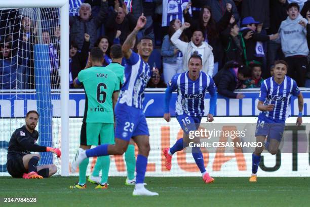 Atletico Madrid's Slovenian goalkeeper Jan Oblak reacts to Alaves' Uruguayan midfielder Carlos Benavidez's opening goal during the Spanish league...