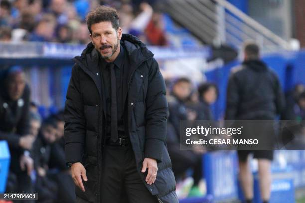 Atletico Madrid's Argentinian coach Diego Simeone reacts to the opening goal scored by Alaves' Uruguayan midfielder Carlos Benavidez during the...
