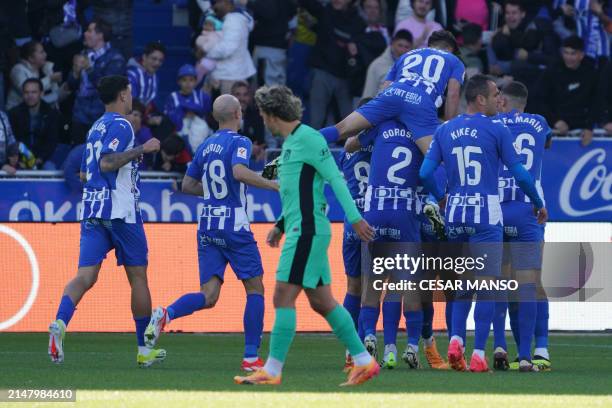 Alaves players celebrate the opening goal scored by Alaves' Uruguayan midfielder Carlos Benavidez during the Spanish league football match between...