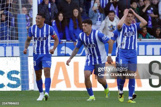 Alaves' Uruguayan midfielder Carlos Benavidez celebrates scoring the opening goal during the Spanish league football match between Deportivo Alaves...