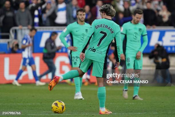Atletico Madrid's French forward Antoine Griezmann and teammates react to Alaves' second goal during the Spanish league football match between...