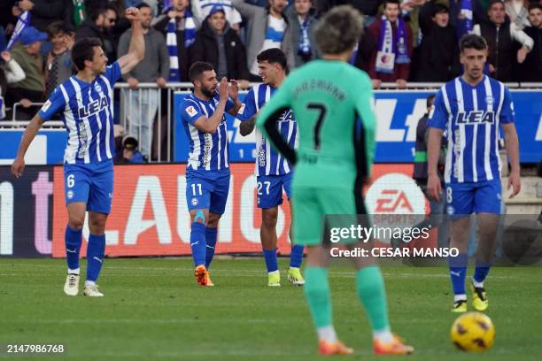 Alaves' Spanish forward Luis Rioja celebrates scoring his team's second goal during the Spanish league football match between Deportivo Alaves and...