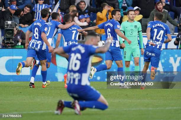 Alaves players celebrate their second goal scored by Alaves' Spanish forward Luis Rioja during the Spanish league football match between Deportivo...