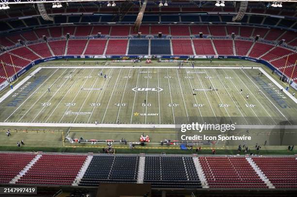 Few people mingle along the empty field and stadium before a game between the Memphis Showboats and the St. Louis Battlehawks on Saturday April 20 at...