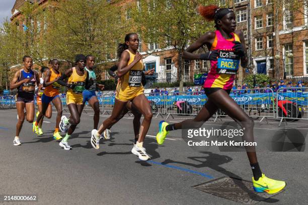 Elite women runners, including the eventual winner Peres Jepchirchir of Kenya and second-placed Tigst Assefa of Ethiopia, compete in the Women's Race...
