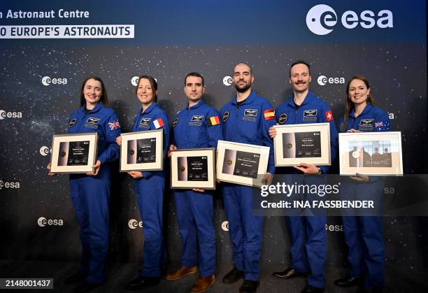 European Space Agency astronaut graduates Rosemary Coogan, Sophie Adenot, Raphael Liegeois, Pablo Alvarez Fernandez and Marco Sieber holding their...