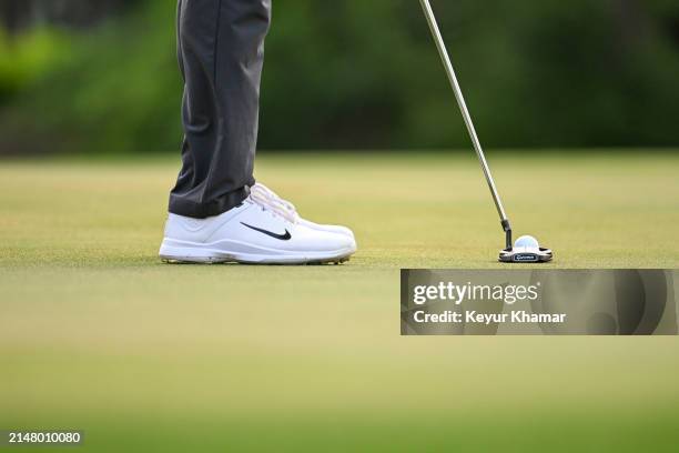 Detail of the TaylorMade putter used by Scottie Scheffler as he putts on the 17th hole green during the continuation of the final round of the RBC...