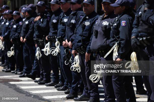 Police officers stand in front of the entrance of Columbia University which is occupied by pro-Palestine protesters in New York on April 22, 2024. US...
