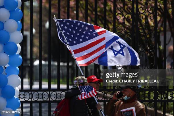 Pro-Israel protesters walk in front of the entrance of Columbia University which is occupied by pro-Palestine protesters in New York on April 22,...