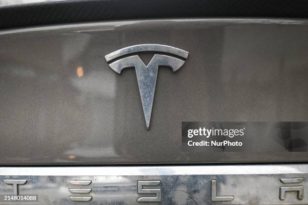 Tesla logo seen on a Tesla car parked in downtown Edmonton, on April 20 in Edmonton, Alberta, Canada.