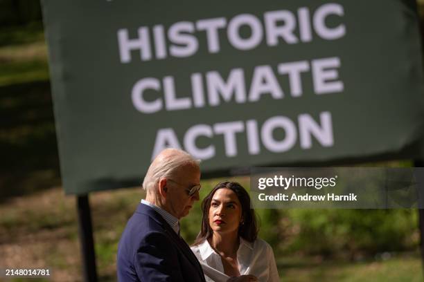 President Joe Biden speak with Rep. Alexandria Ocasio-Cortez following a speech at Prince William Forest Park on April 22, 2024 in Triangle,...