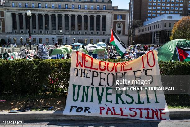 People rally on the campus of Columbia University which is occupied by pro-Palestinian protesters in New York on April 22, 2024. US President Joe...